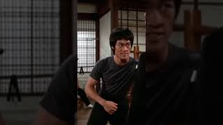 Bruce Lee teaching to Roger Moore as James Bond