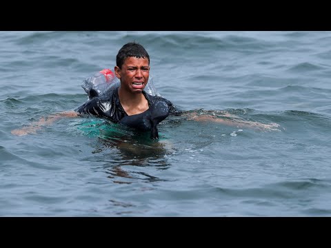 Ceuta: Migrant boy swims to shore with plastic bottles tied to himself