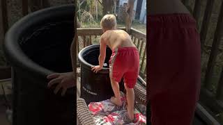 Boy in bathing suit jumps into Robux ice bath then jumps out and begins to cry