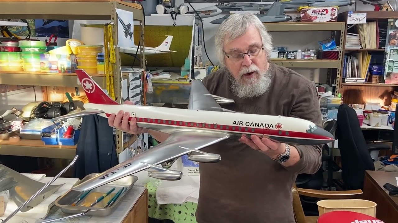 Al Pelletier with the 1/50 scale Air Canada DC-8 he beautifully restored