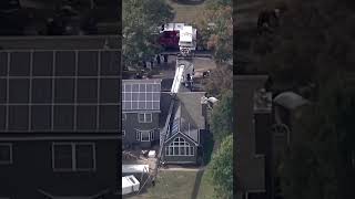 Crane collapses onto New Jersey home while moving hot tub