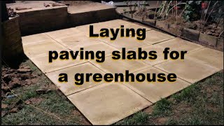 Laying paving slabs for a greenhouse