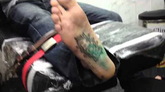 Symon Elliott's - bottom of the foot tattoo - POW