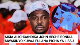 JOHN HECHE AFUNGUKA HAYA MWAKINYO KUVAA FULANA YENYE SURA YA TUNDU LISSU