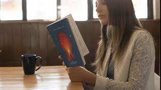 gorgeous girl reading a book video