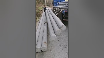 Unloading utility poles is easy.