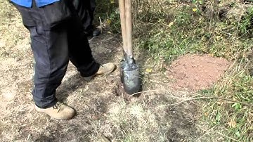 How to install a fence post into soil