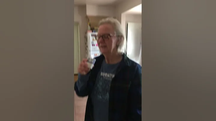Carol tries a thimbleful of Myer's Dark Rum