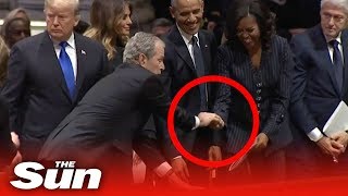 George W Bush gives Michelle Obama a mint at his dad's funeral