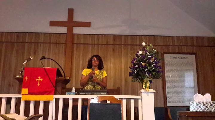 Angelia Moore singing "Praise His Name" video