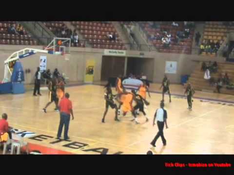Fumani Marhanele (#10 South Africa) delivers the sledge hammer on C Muchata (#11 Mozambique) in the last game of the FIBA Zone VI Qualifiers. Such displays of raw athleticism should be banned.