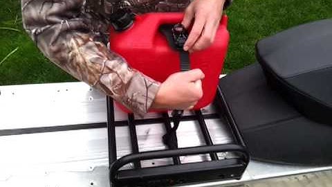 Loading Fuel Cans into a Port Tack Snowmobile Rack