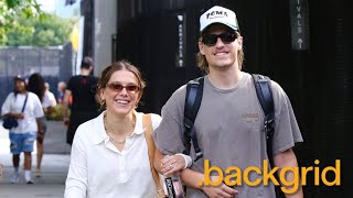 Millie Bobby Brown and Jake Bongiovi walk arm-in-arm at the heliport in New York, NY