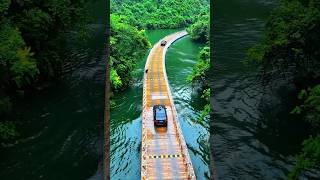 Cars gliding atop a floating bridge in central China