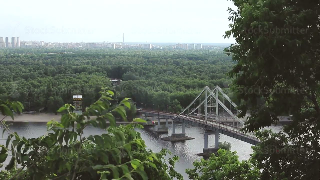 Pedestrian bridge over the Dnieper River in Kiev, Ukraine. View from the top of the river in Summer