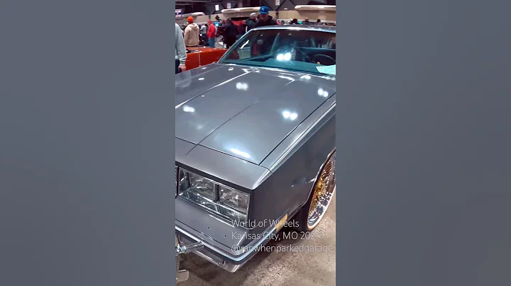 1984 Oldsmobile Cutlass Supreme on 20" Gold Dayton Wheels at World of Wheels 2024 in Kansas City, MO