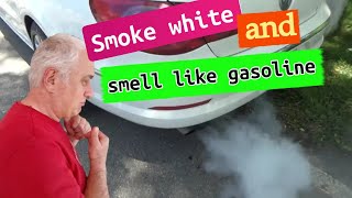 Why does white smoke coming from my exhaust smell like gas? What does this mean, reasons