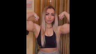 Beautiful muscle girl flex super biceps