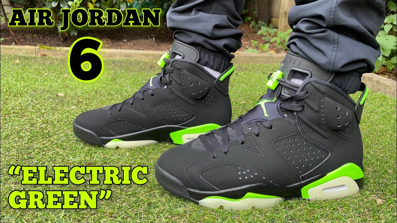 black and green jordan 6 on feet