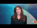 full video Italian TV presenter flashes audience behind glass desk funny