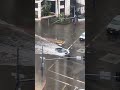 Tesla plows through flooded street in san diego