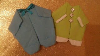 شكل 1 : طريقة طي مناديل ورقية على شكل لبس بيبي لإستقبال مولود جديد أو للسبوع