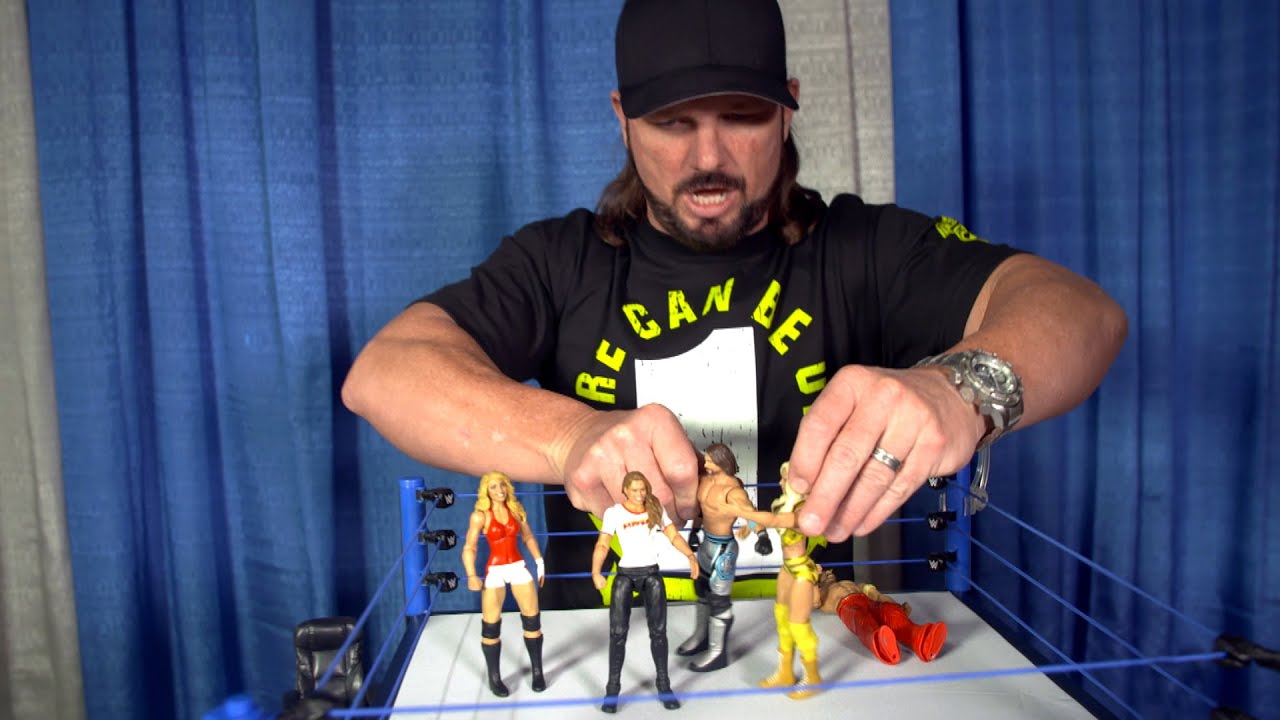 Aj Styles Checks Out Ronda Rousey S First Wwe Action Figure Youtube