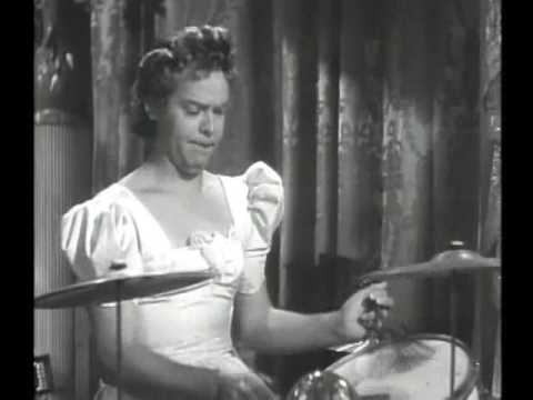 Ruth Terry sings "You Can't Cry On My Shoulder". Then Dagwood (Arthur Lake) beats out a conga, "Brazilian Cotillion", while Blondie (Penny Singleton) and Manuel RodrÃ­guez (Tito GuÃ­zar) sing and dance! This is one of a handful of awesome conga sequences in movies in the early '40s and one of my personal favorites! I love Blondie's dress and ruffles as she conga's towards the camera!! A great example of the cartoon-like quality that transfered well from strip to movie--Blondie's wardrobe!