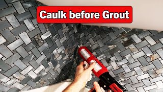 Caulk before Tile Grout