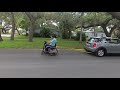 Wheelchair towing a car!  Must see!