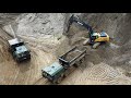 John Deere E330LC loading monster custom MAN KAT 8x8 dump trucks - Drone video