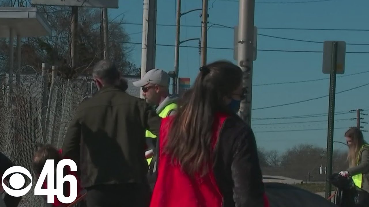 Volunteers clean trash from Vine City