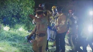 Firefighters speak on rescuing Indy, a retired police dog that was trapped in 60 foot hole