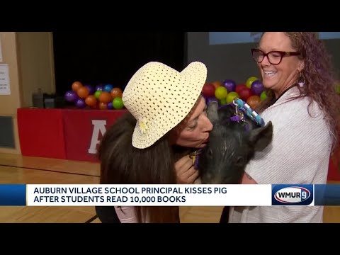 Auburn Village School principal kisses pig after students read 10,000 books