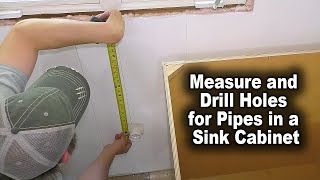How to Measure and Drill Holes for Pipes in a Sink Cabinet | The Fixer Clips