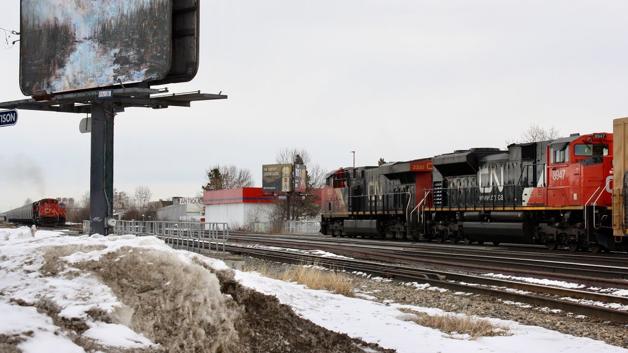 Two Trains Meet With a Long Line of Saskatchewan Grain Hoppers!