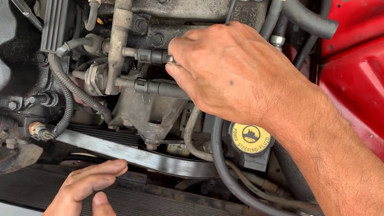 93 Jeep Cherokee XJ, how the fan belt tensioner works. YouTube