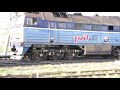 2TE116 diesel locomotive with train departuring Gatchina cargo train station