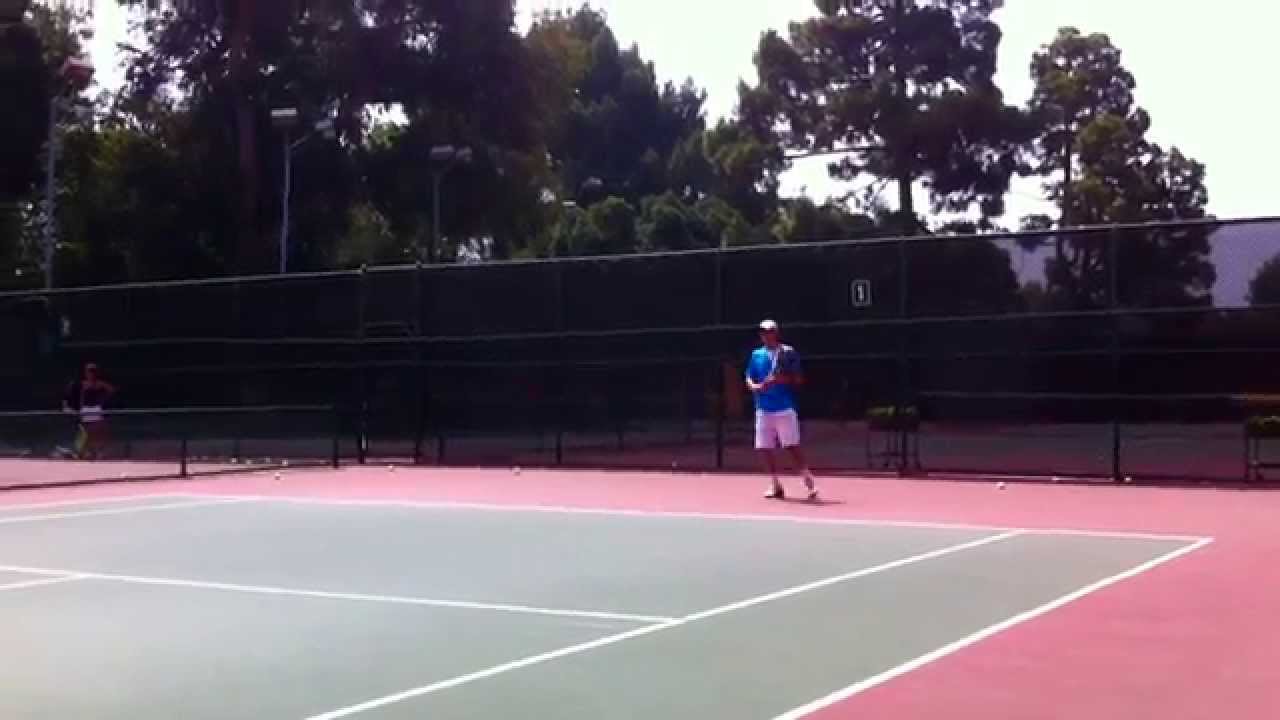 Sam Querrey and Robbie Bellamy spare at the Palisades Tennis Center