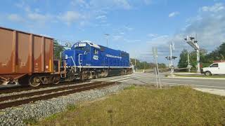 Northbound FEC 422 passing NSB yard and a MOW unit appearing near the end. 1/15/24