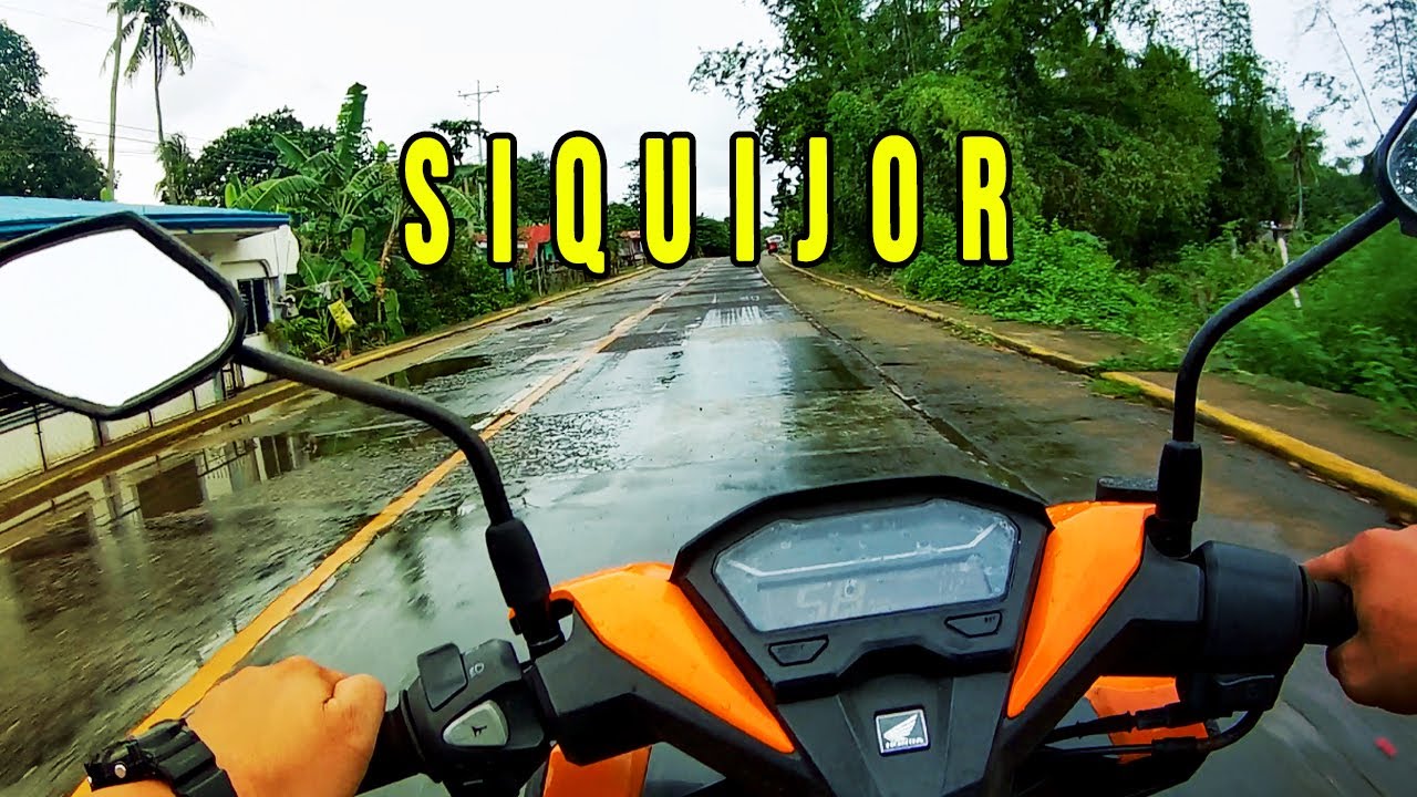 Driving a Motor Bike in a Wet Road San Juan to Siquijor Port Philippines in HD