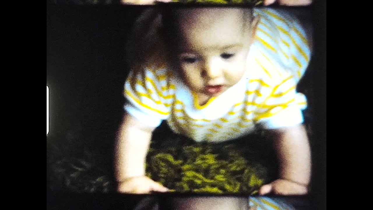 David [baby] crawling, Nikki, Philip, Mama North.  Playing on the patio