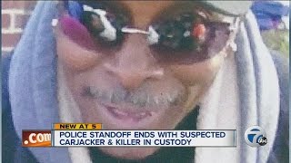 Police standoff ends with suspected carjacker and killer in custody