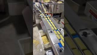 Full automatic feeding and packing system for egg roll by two turning dish.