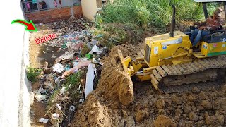 Operator machines working with dirt project dozer push soil delete trash with dump trucks unload