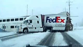 Police Dashcam Footage Captures Train Crashing Into FedEx Truck