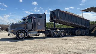 Trucks offloading sand and gravel #kenworth #peterbilt #truck