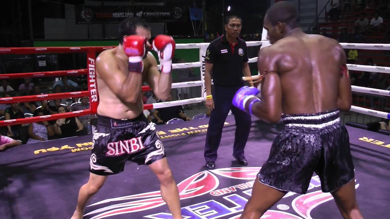 GJ from USA (Sinbi Muay Thai Red corner) fights Rawai boxing stadium