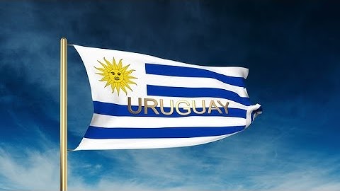 Uruguay Flag Slider Style With Title. Waving In The Wind With Cloud Background A Stock Animation