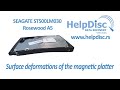 Seagate hard drive with damaged and slightly warped magnetic platter